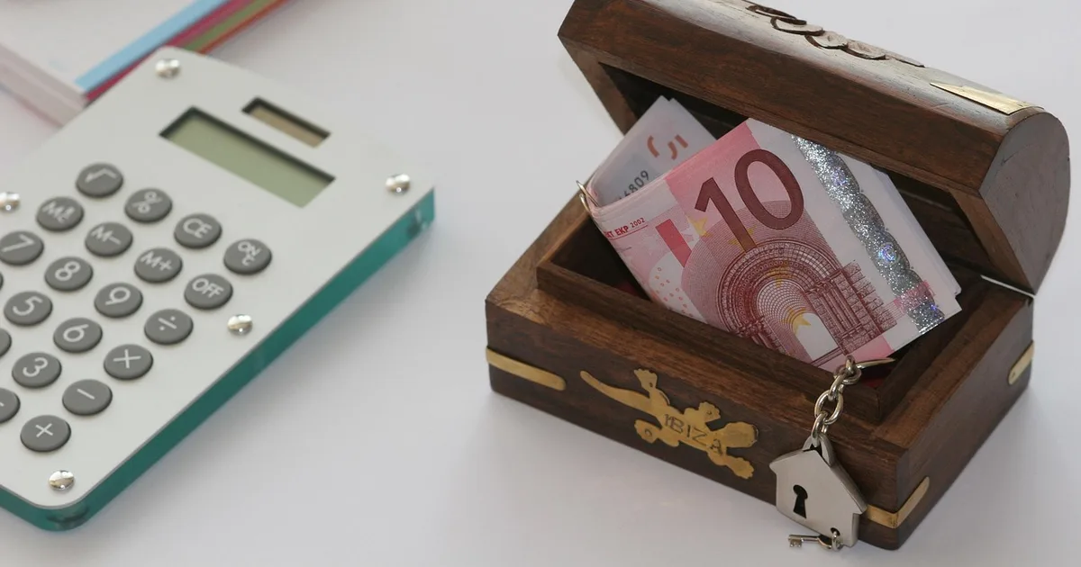 Bank passbook and calculator on a desk for comparing certificate of deposit rates