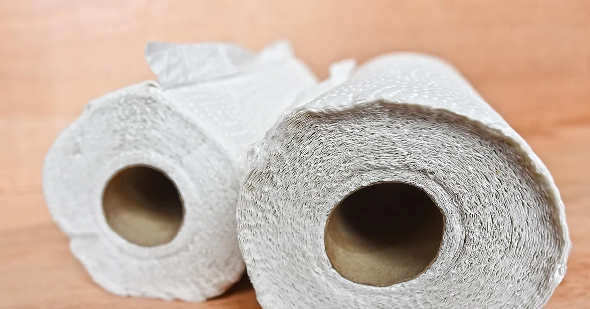 Paper towel rolls stacked on a kitchen counter